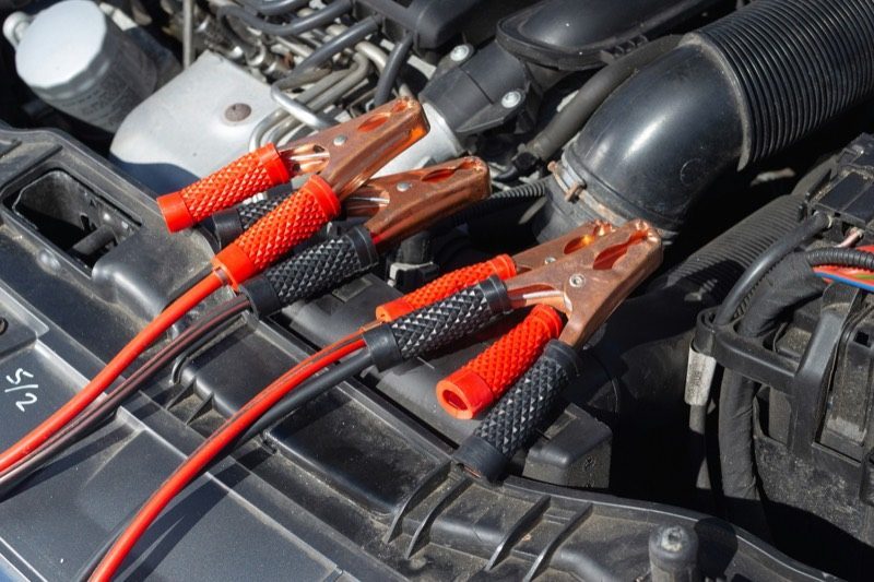 Jumper cables in an engine bay for battery service