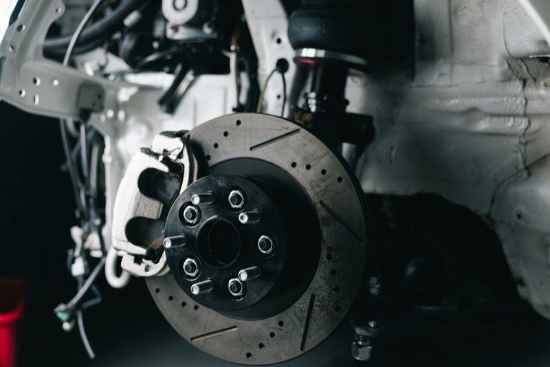 Close-up of a vehicle brake rotor and caliper